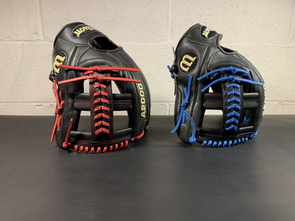 Red and blue laced baseball gloves. restored cleaned and re-laced